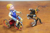 TWO WIND-UP TIN TOYS.  America