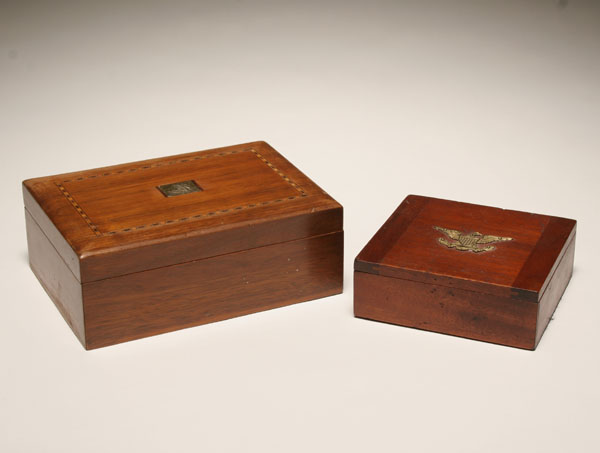 Two wooden boxes with metal trim;
