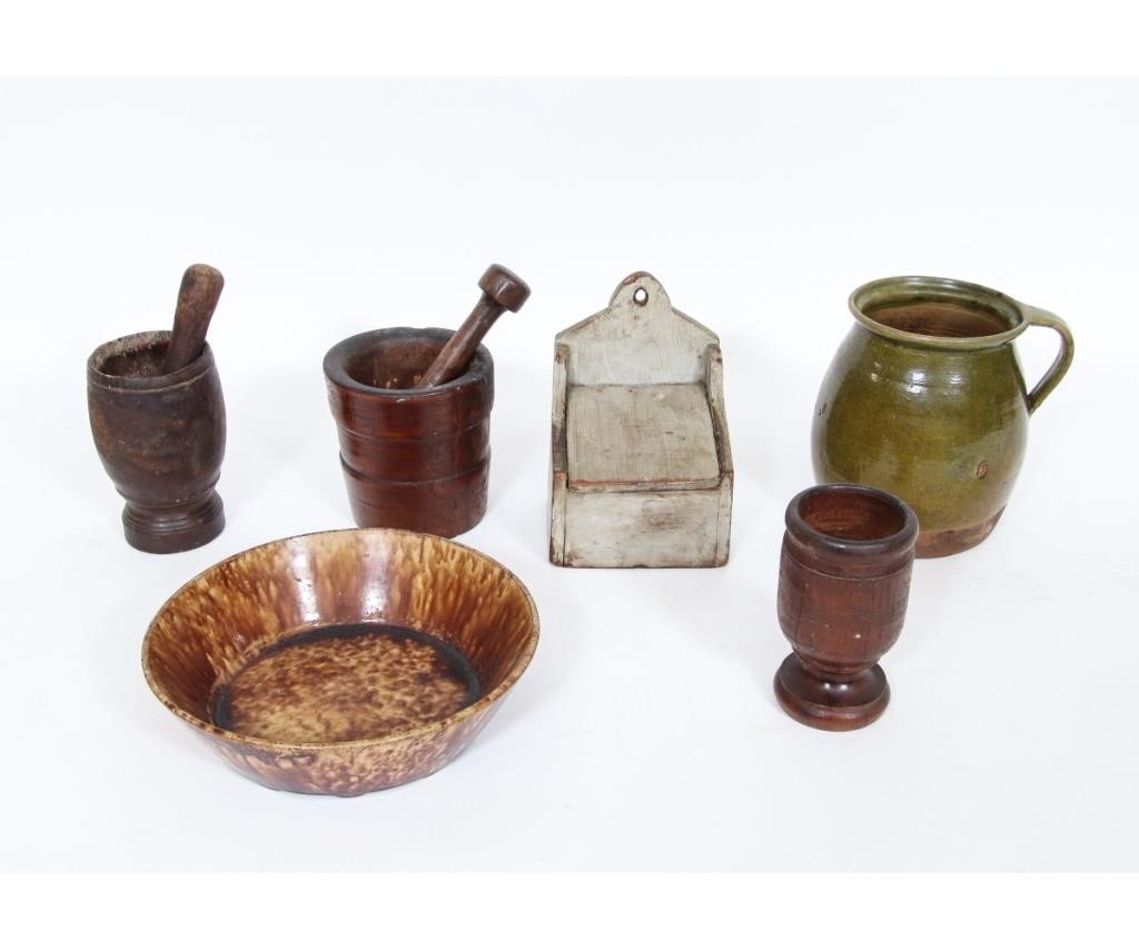 Two wooden mortise and pestles, a