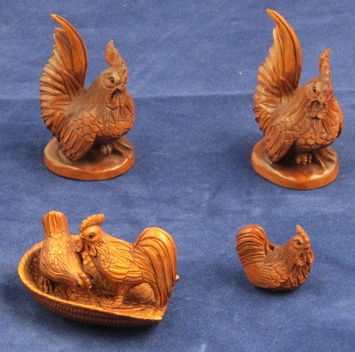 Two wooden netsuke signed in the