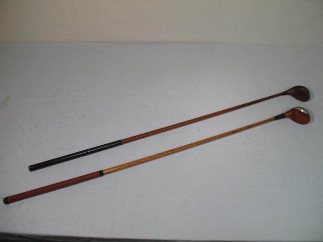 Two wooden shaft left handed golf