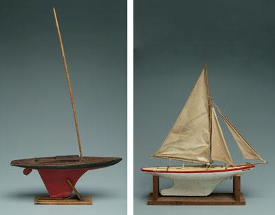 Two wooden toy pond sailers: one