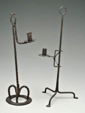 Two wrought iron candleholders