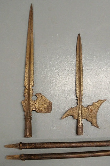 Two wrought iron halberds with wood