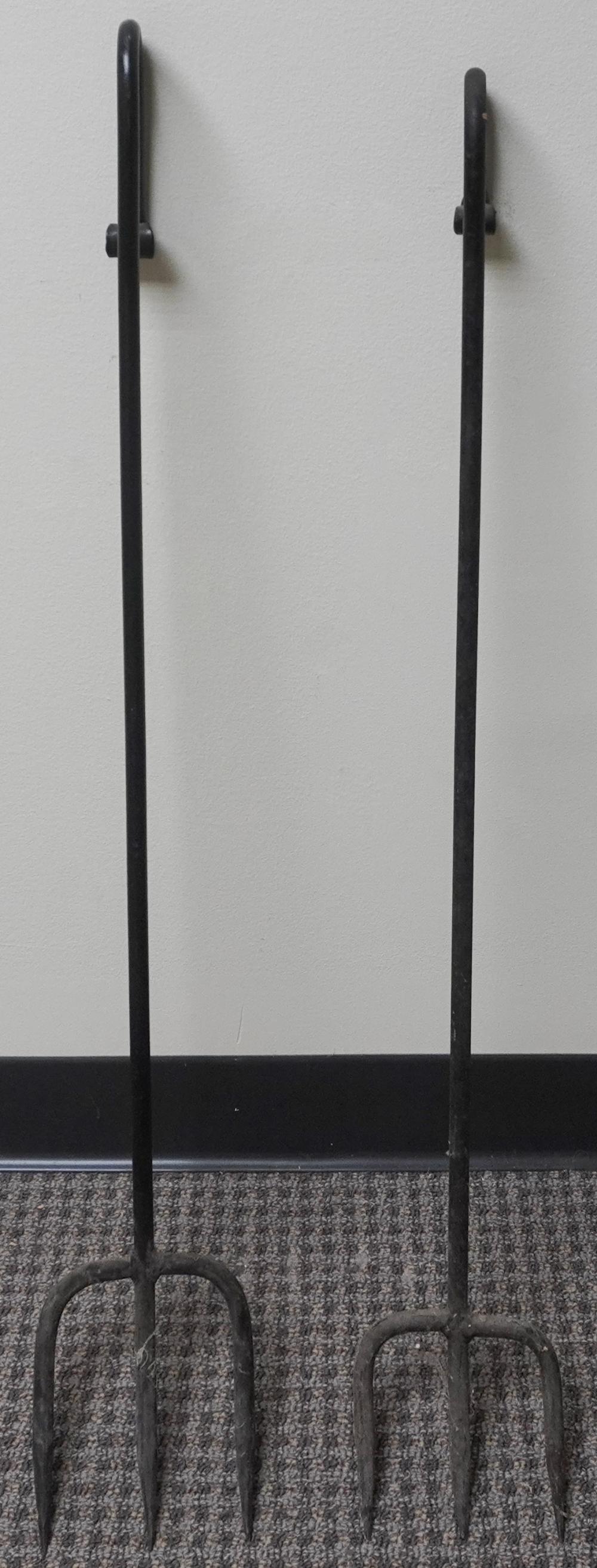 TWO WROUGHT IRON HEARTH TOOLSTwo