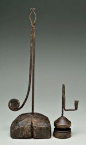 Two wrought iron light holders