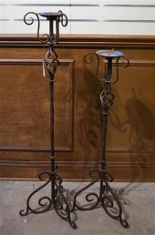 TWO WROUGHT IRON PRICKET CANDL