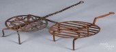 TWO WROUGHT IRON ROTATING BROI
