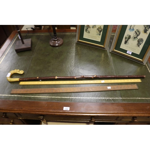 Two yard rulers, along with a