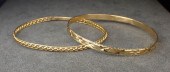 TWO YELLOW GOLD SLIP-ON BANGLE