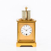 UNUSUAL GILT BRASS TABLE CLOCK
