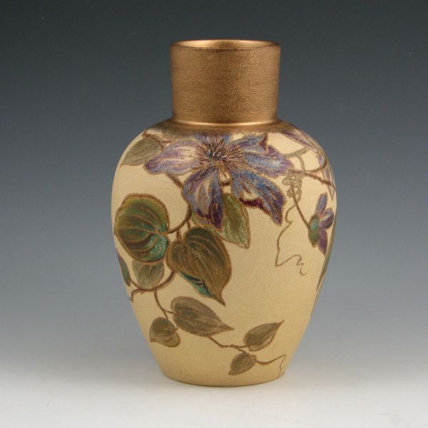 Unusual Owens vase best described