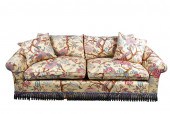 UPHOLSTERED SOFAwith wood tass