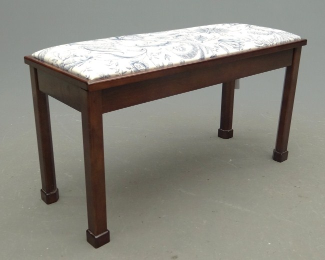 Upholstered top piano bench.