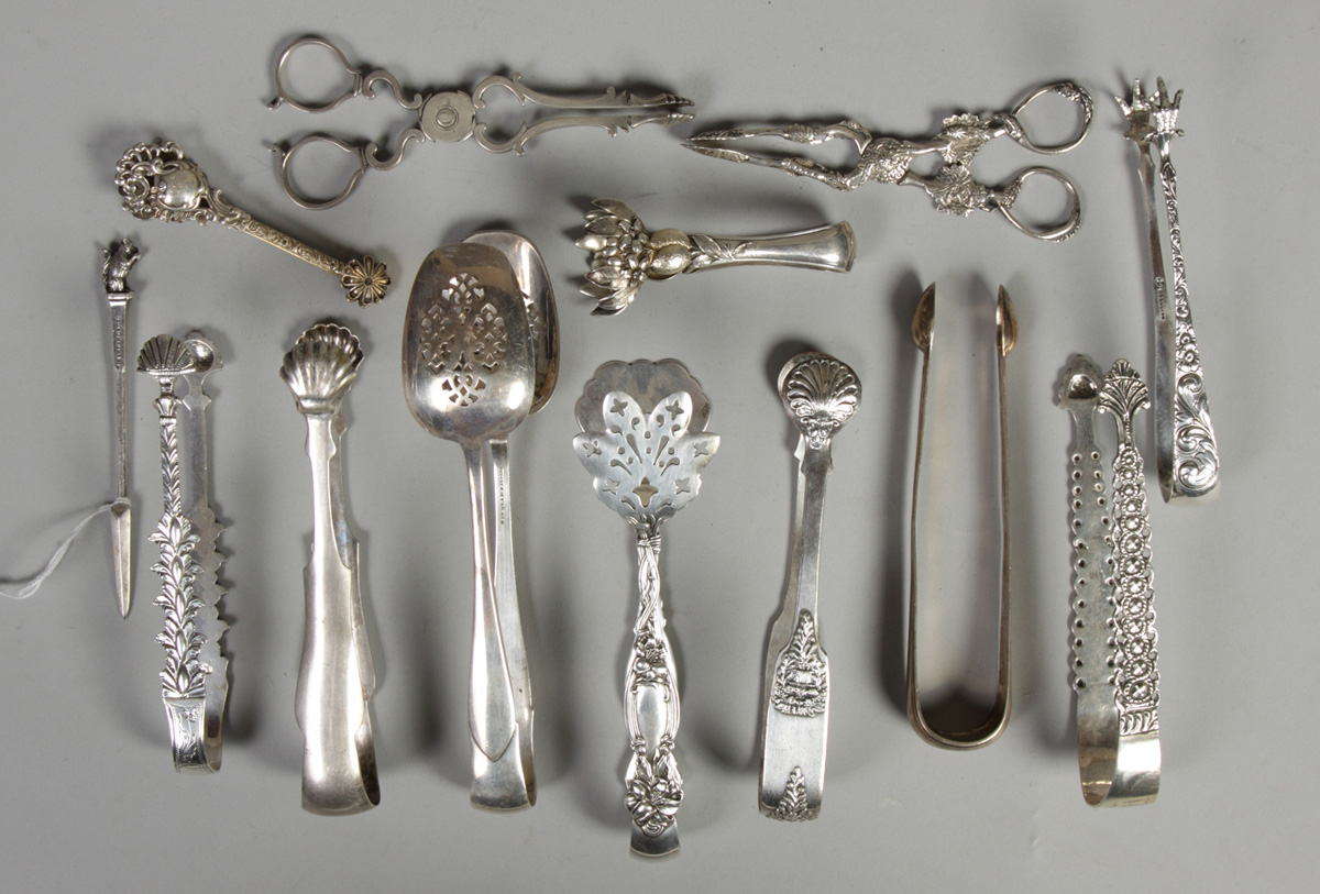 Various Sterling sugar tongs 282.