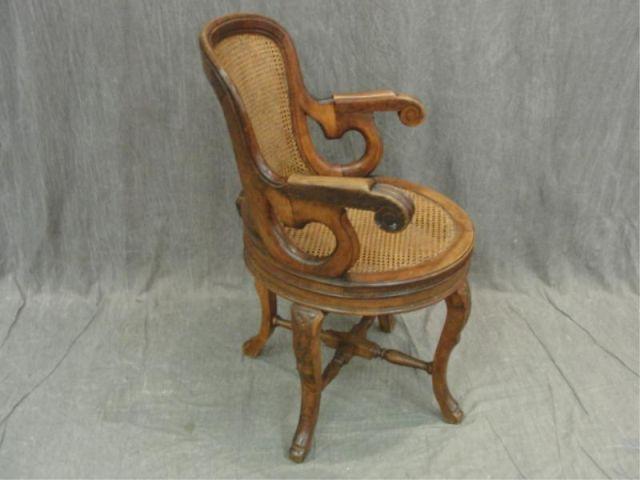 Victorian Caned Swivel Chair.