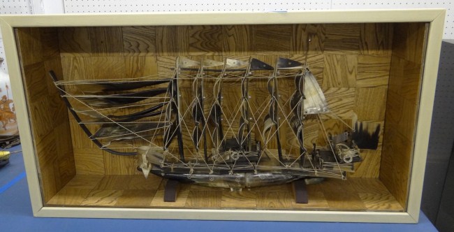 Vintage horn boat in shadow box.