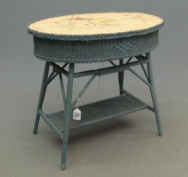 Vintage wicker table in blue paint.