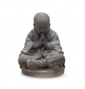 VOLCANIC ASH SCULPTURE OF A BU