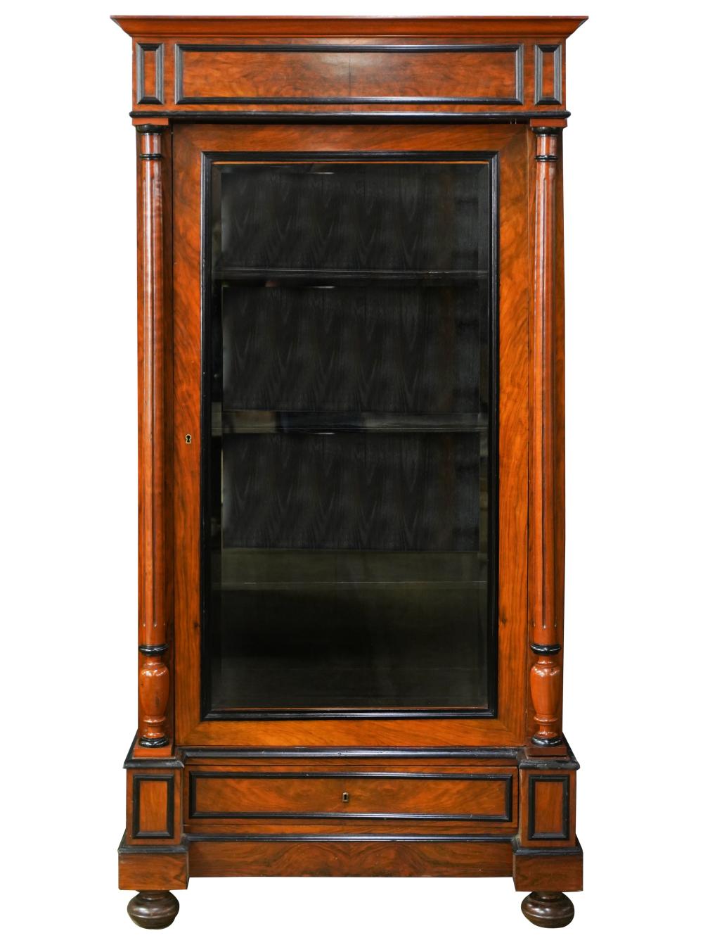 WALNUT AND EBONIZED WOOD ARMOIREthe