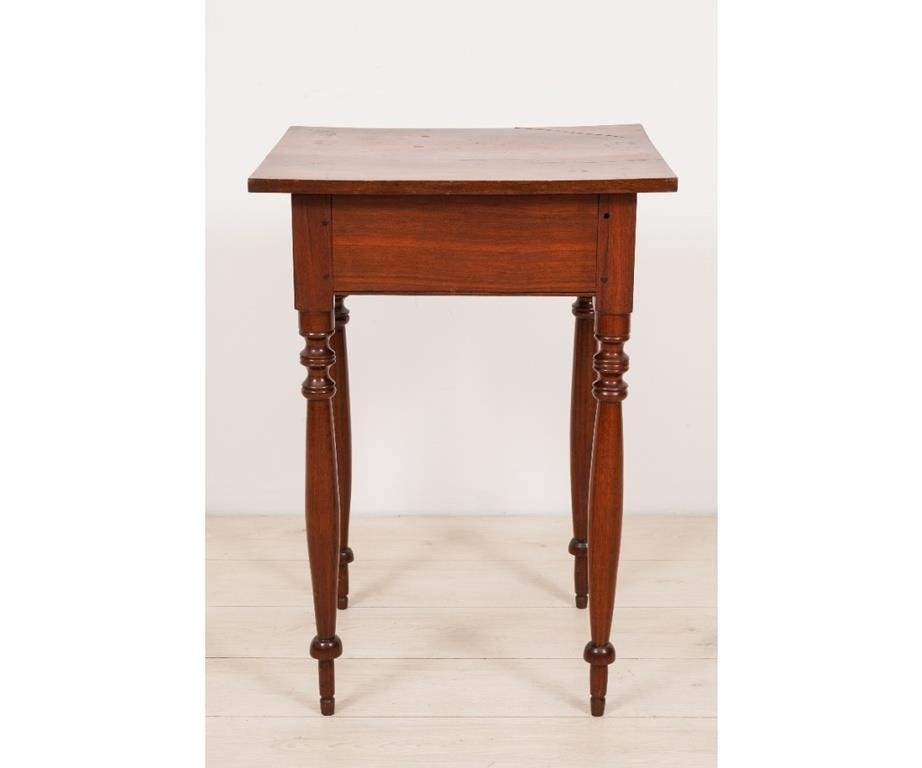 Walnut stand with turned legs and