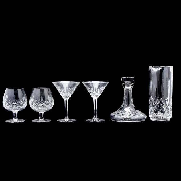 WATERFORD, TWO DECANTERS AND FOUR