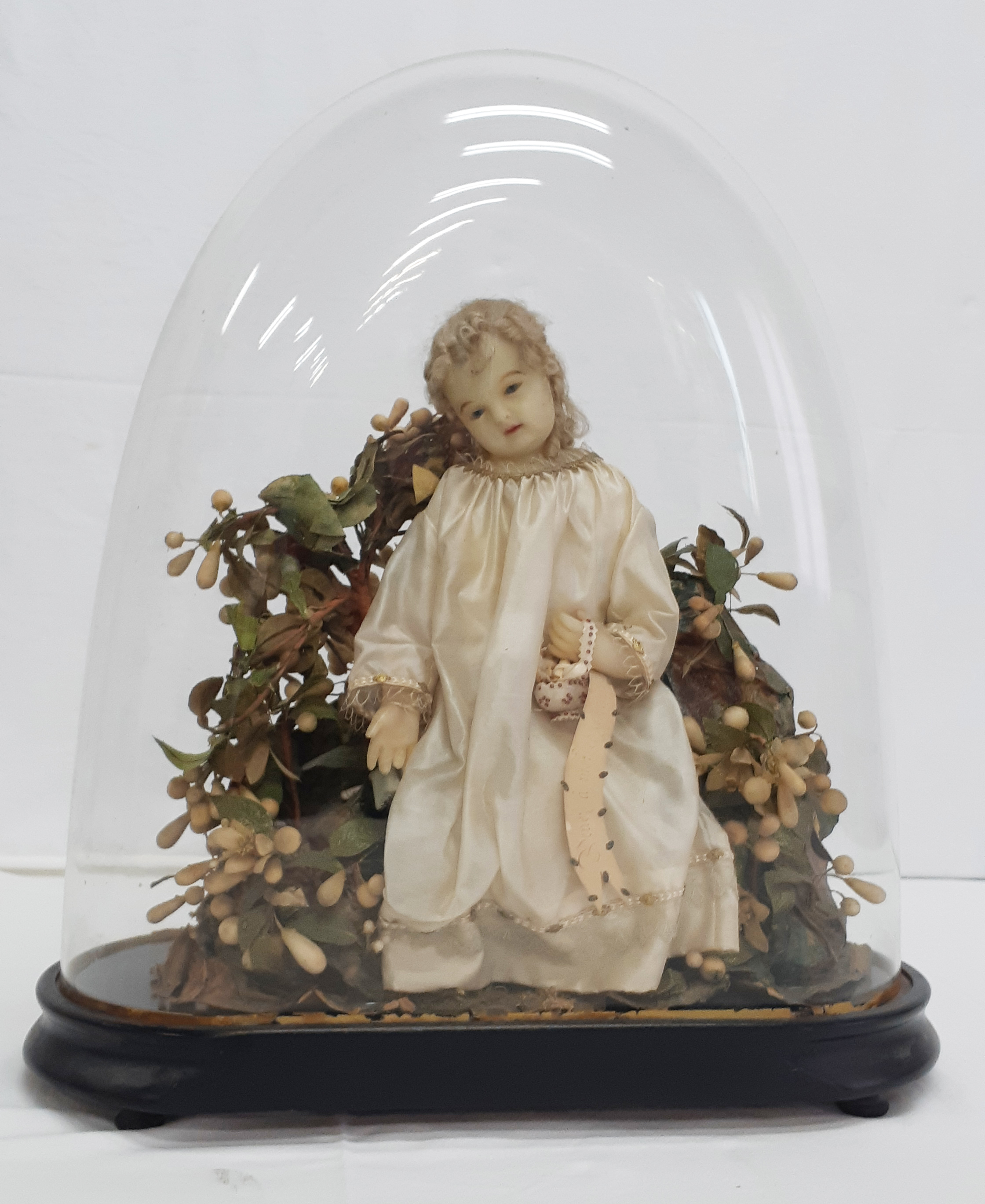 WAX DOLL OF SMALL CHILD IN GLASS