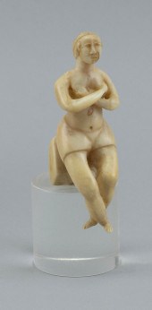 WHALE IVORY CARVING OF A SEATE