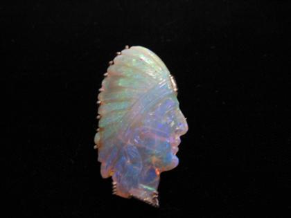 Whimsical carved white opal brooch