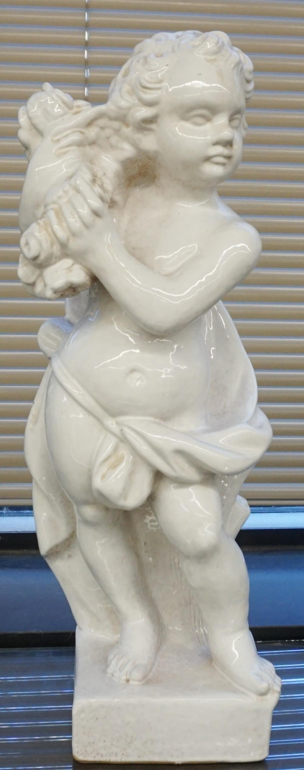 WHITE GLAZED CERAMIC FIGURE OF A