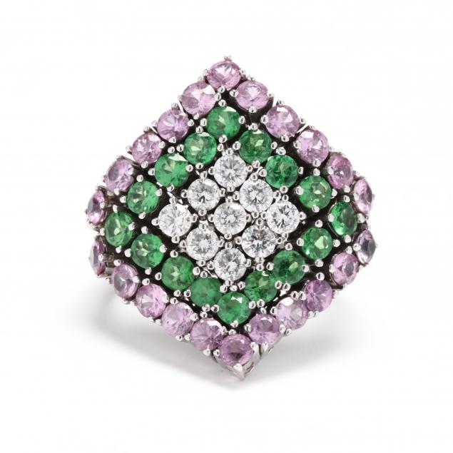 WHITE GOLD AND GEM-SET RING In a