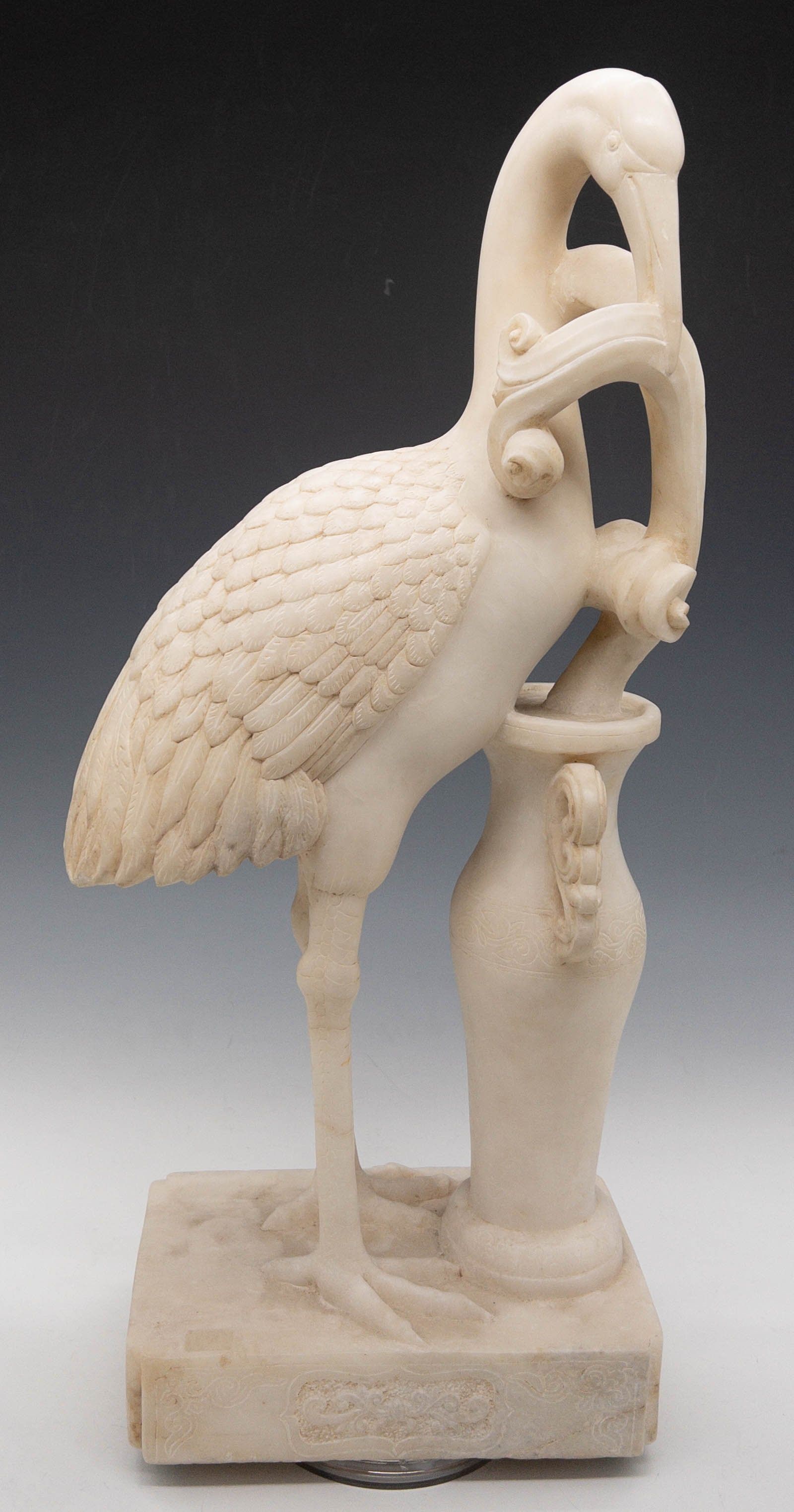 WHITE MARBLE STORK WITH VASE ON