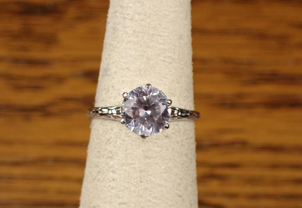 WHITE SPINEL SOLITAIRE AND GOLD