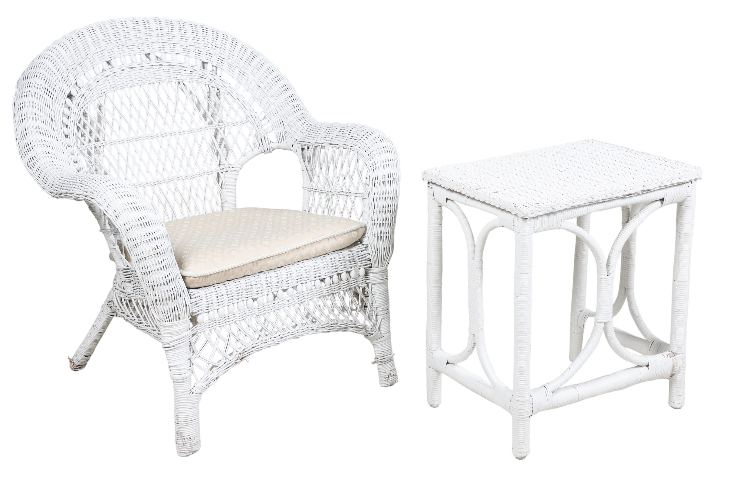 White wicker patio armchair and