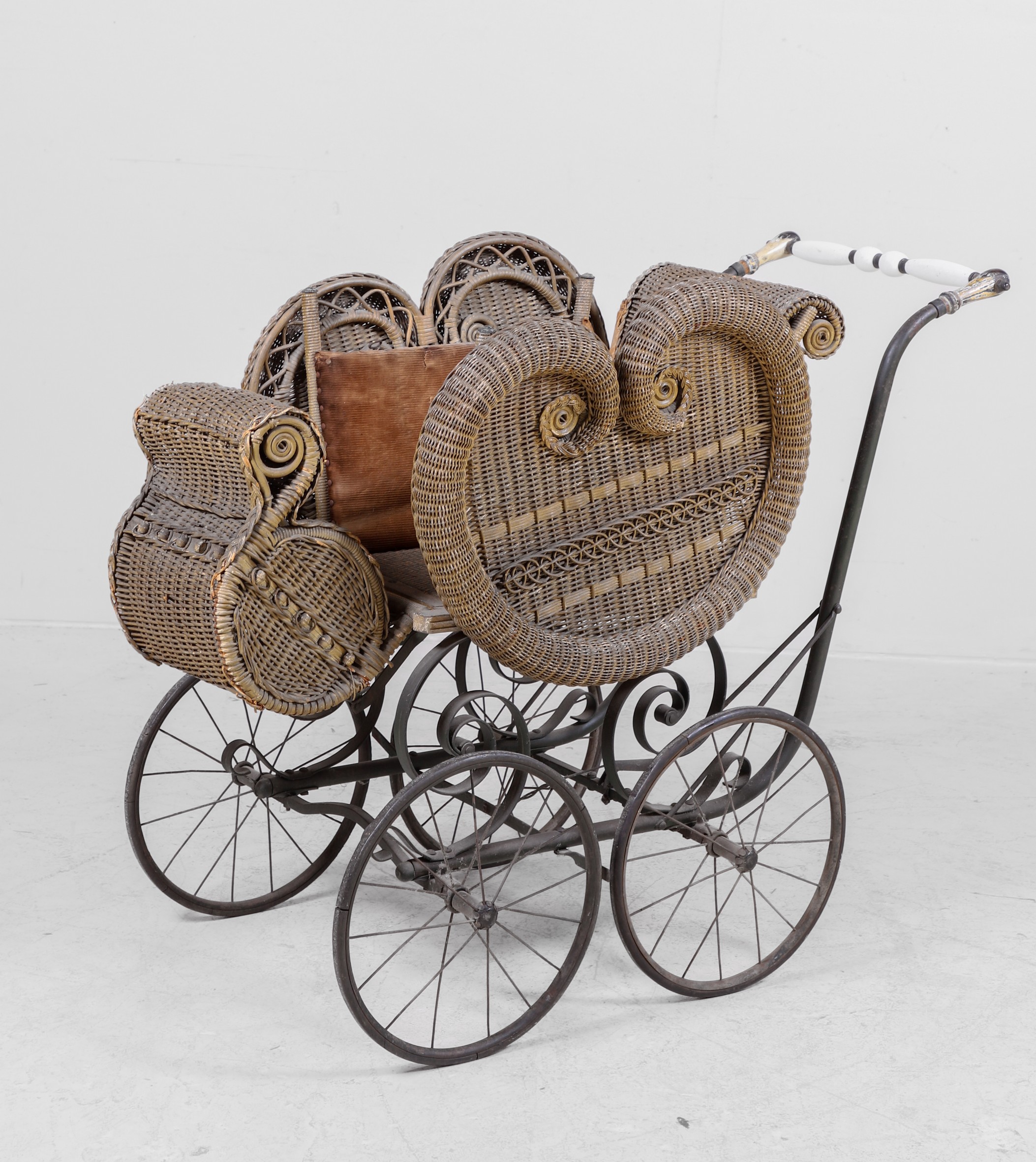 Wicker baby carriage, scrolled iron