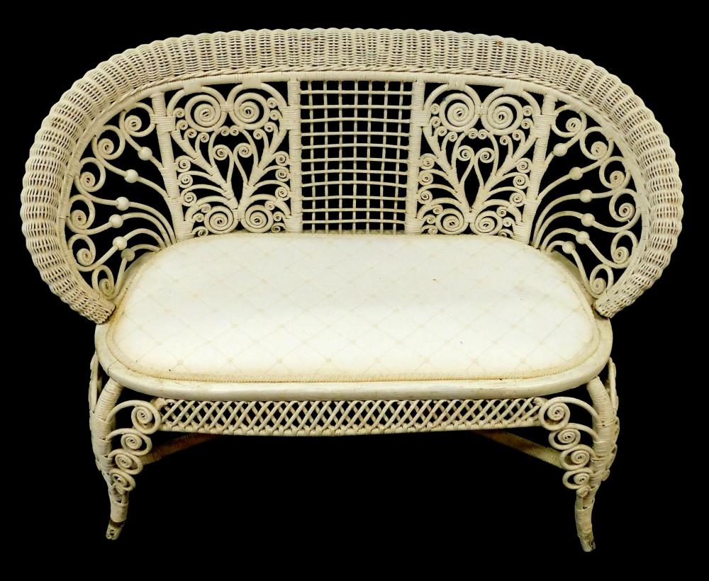 WICKER SETTEE WITH SCROLLWORK AND