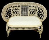 WICKER SETTEE WITH SCROLLWORK