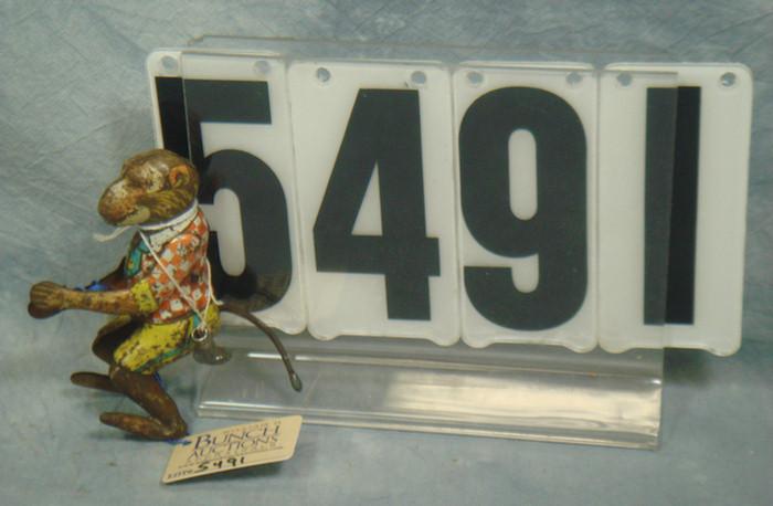 Wind up all tin monkey, marked ck