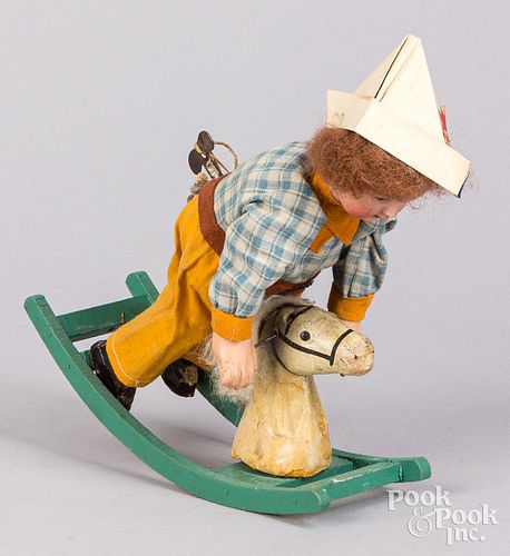 WIND-UP BISQUE HEAD DOLL ON ROCKING