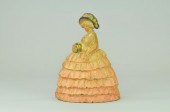 WOMAN IN LARGE HOOP SKIRT DOOR