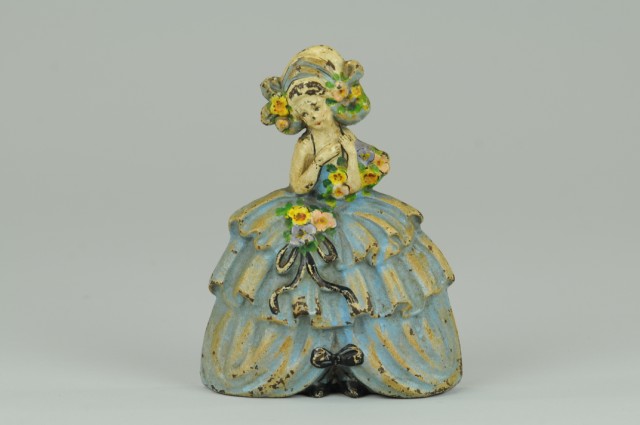 WOMAN IN RUFFLED SKIRT DOORSTOP
