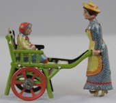 WOMAN PUSHING CHILD IN CHAIR S