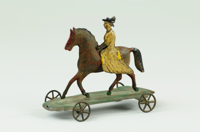 WOMAN RIDING HORSE PULL TOY