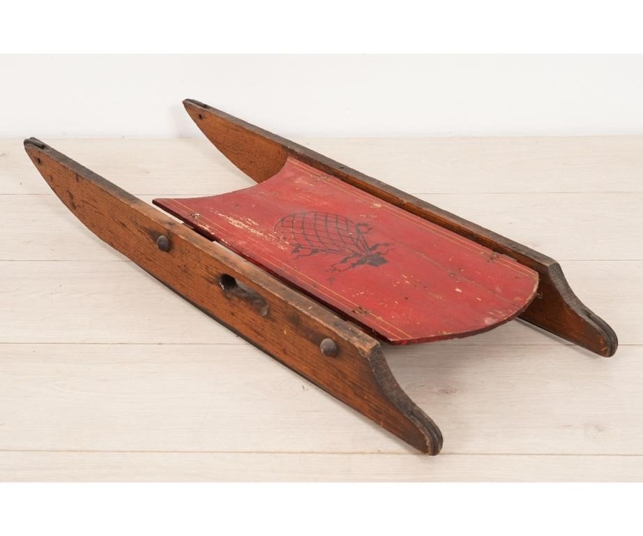 Wood child's sled, painted red with