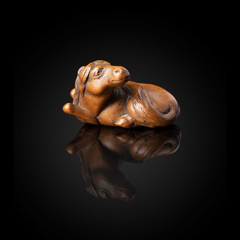 WOOD NETSUKE OF A HORSE BY YASUTADA