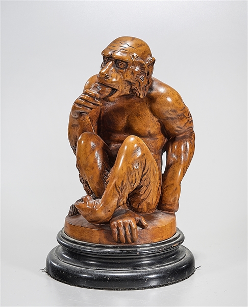 Wood sculpture of a monkey-like