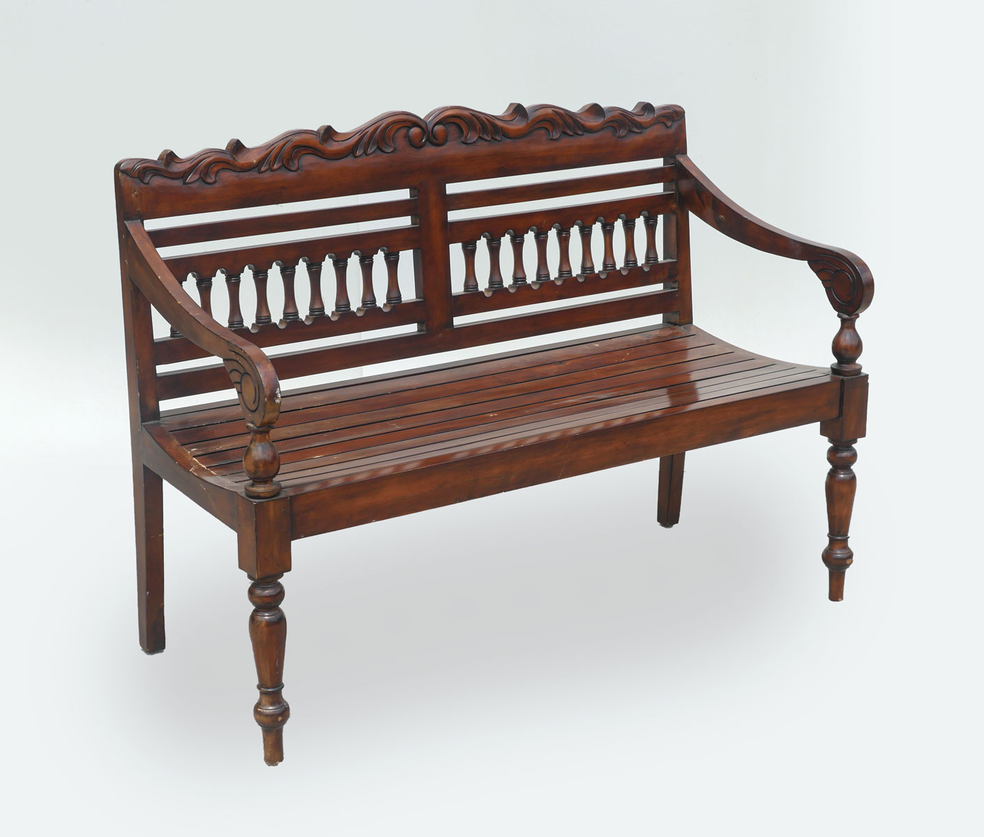 WOODEN BENCH: Carved scrolling