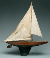 Wooden pond sailer, carved and