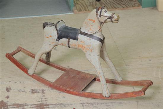 WOODEN ROCKING HORSE. Leather