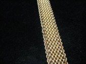 Woven 14 karat yellow gold fle